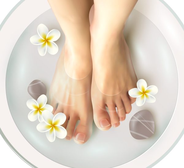 Pedicure spa female feet in spa bowl with water flowers and stones realistic vector illustration